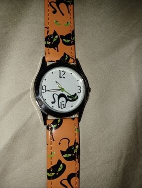 Avon cat watch black orange silver like new unworn